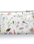 Cosmetic zipper pouch in spring wildflowers with butterflies pattern on white background