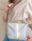 Crossbody purse in earth gray with silver and gold stripes