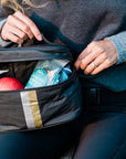 Cosmetic case or lunch box in black with silver and gold stripes