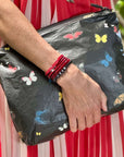 Black Zipper Pouch with Colorful butterflies in red blue yellow orange white.