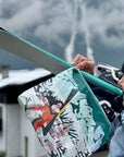 Zipper Pouch with printed scene on the bag of Woman carrying skis to her Chalet