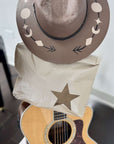 Western hat and Clutch in Beige color with star near a guitar