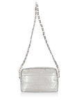 A silver metallic puffer shoulder bag with a matching silver chain strap, shown against a plain white
background.