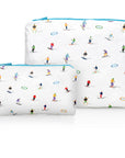 Medium and mini zipper pouch set in white with dancing skiers and ski goggles pattern and blue zipper