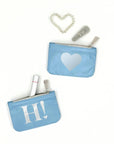 Emergency pouch set in shimmer ice blue color with silver heart and 'H!' logo