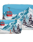 Two zipper pouches with an alpine snowy mountain scene and red gondola print on white background