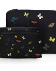 Two black pouches with colorful butterfly patterns on a white background