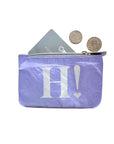 Purple coin purse with 'H!' design on a white background