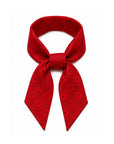 Red silk scarfette featuring the Signature Hi Print, styled as a versatile accessory for handbags, hair, neck, or wrist.