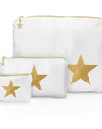 Three white zippered storage pouches in different sizes, each featuring a large metallic gold star on the front and a small gold star charm on the zipper pull, displayed on a clean white background.