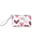 Wristlet with pink heart pattern and 'Gamma Phi Beta' greek letters on a white background
