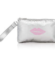 Silver wristlet with a pink lip print on a white background