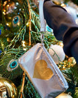 Zip wristlet in silver with gold heart on Christmas tree