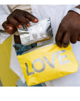 Small yellow zipper pouch with silver LOVE