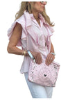 Woman carrying Zipper Clutch in Baby Pink Bandana Print