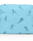 Medium shimmer blue zipper pouch with blue skier print on white background