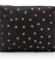 medium zipper pouch in black with myriad of gold stars on white background