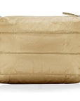 A gold-colored clutch bag with a smooth texture, featuring a foldover closure with a magnetic fastening and an exterior zipper pocket.