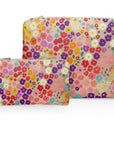 Set of two organizational pouches in colorful poppies pattern on white background