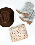 Shimmer beige equestrian zipper pouch with brown cowboy hat and rhinestone cowgirl boots