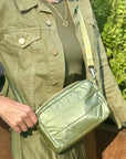 Shimmer olive green mini puffer purse glistening in the sun