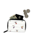 White puffer wallet with colorful dancing skiers pattern and black zipper