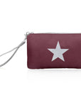 Zip wristlet in shimmer cabernet with a silver star