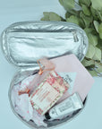 Cosmetic case in silver filled with beauty products