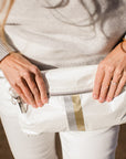 Crossbody purse in shimmer white with silver and gold stripes