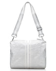 Crossbody purse in metallic silver with white stripes