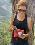 Crimson red mini zipper pack with a silver heart