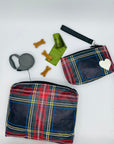 Medium and mini zipper pouch in tartan plaid pattern with dog bags and treats surrounding on white background