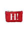 A red zippered pouch featuring a large white 'H!' with an exclamation mark and a small heart on the front, set against a plain white background.