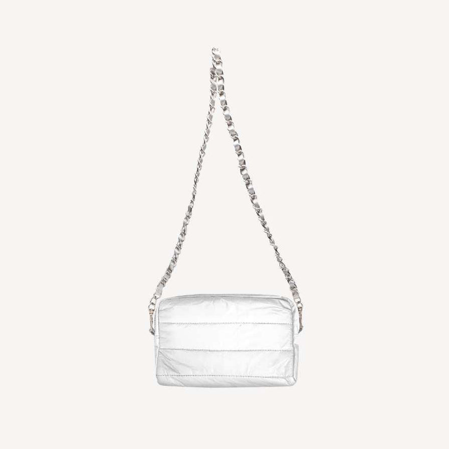 Shimmer white purse clutch bag with chain strap on a light gray background