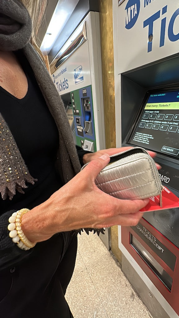 Silver puffer zipper wallet with black zipper