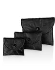 Jewelry Set of Three Black Mini snap Pouches on white background