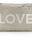 Jumbo zipper pouch in shimmer beige with silver LOVE on white background
