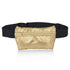 A metallic gold fanny pack attached to a black elastic belt, shown against a plain white background with a soft reflection below.