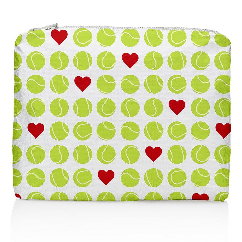 A medium-sized zipper pouch with a pattern of green tennis balls and red hearts on a white background.