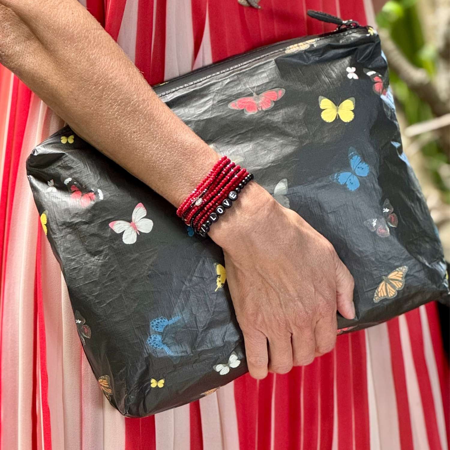 Black Zipper Pouch with Colorful butterflies in red blue yellow orange white.