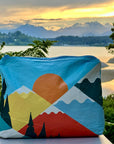 Medium Zipper Pouch Mountain Sunset Scene with sun setting and snow capped mountains