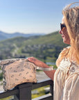 Women wearing Clutch Wristlet in Beige Bandana Print overlooking Mountains