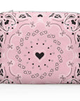 Pink pouch with black heart and bandana pattern on a white background