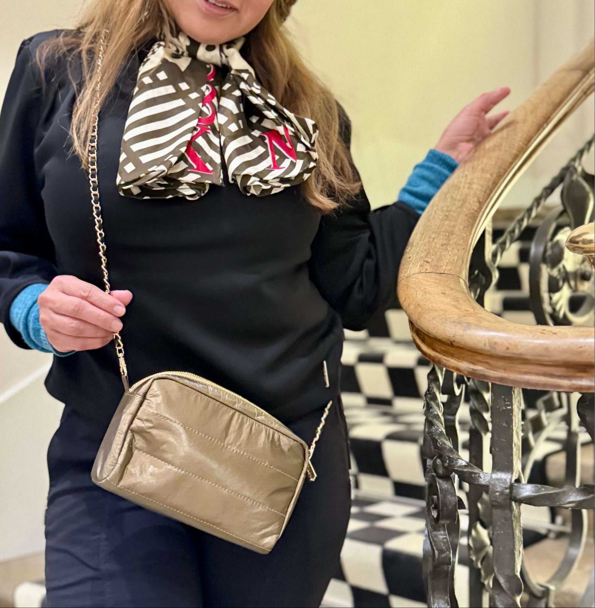 Women wearing crossbody purse in shimmer bronze gold chain link purse strap