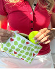 Small zipper pouch with tennis balls and heart print.