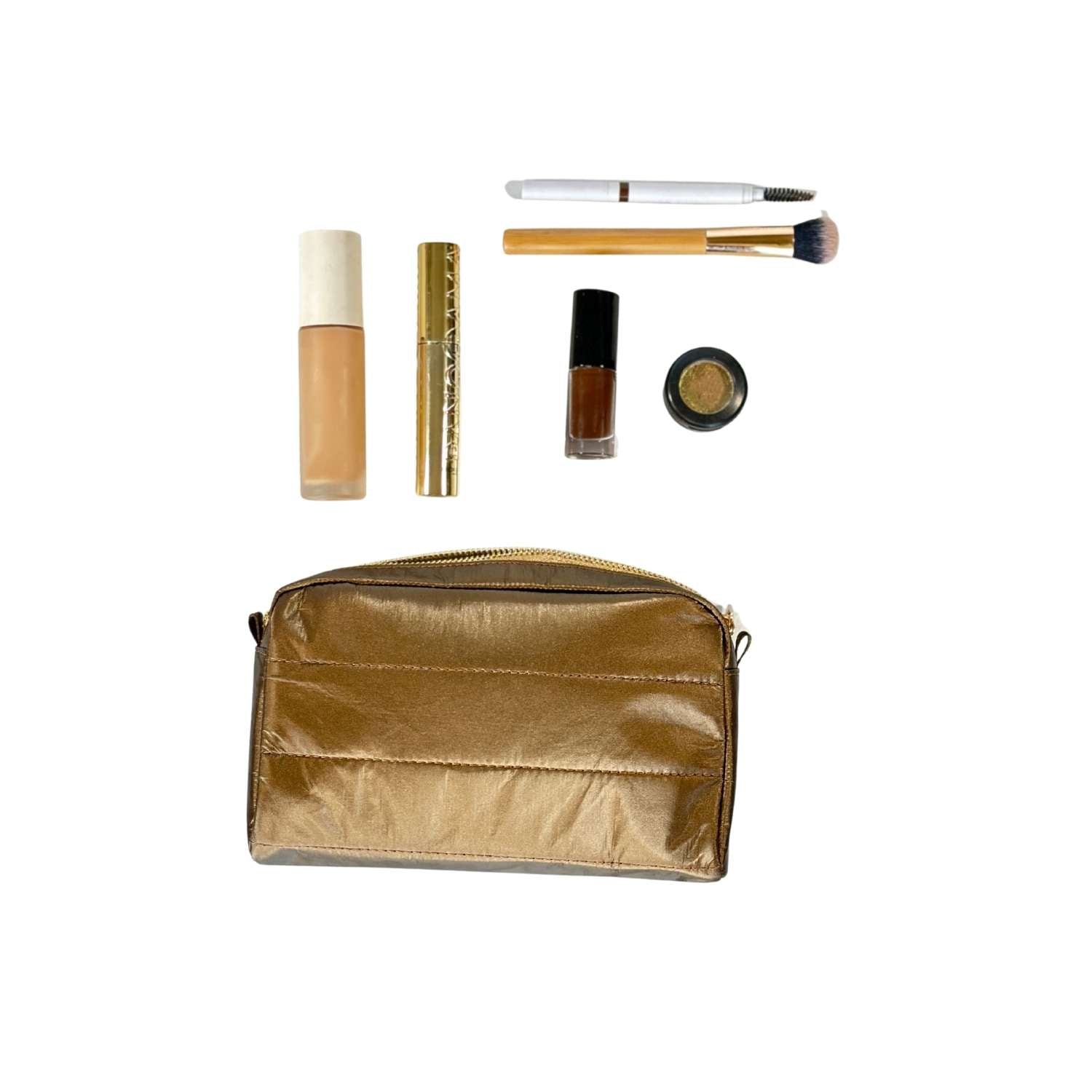 Bronze makeup pouch with various cosmetic items on a white background
