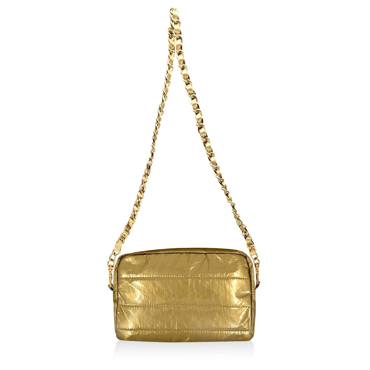 Gold handbag with chain strap on a white background