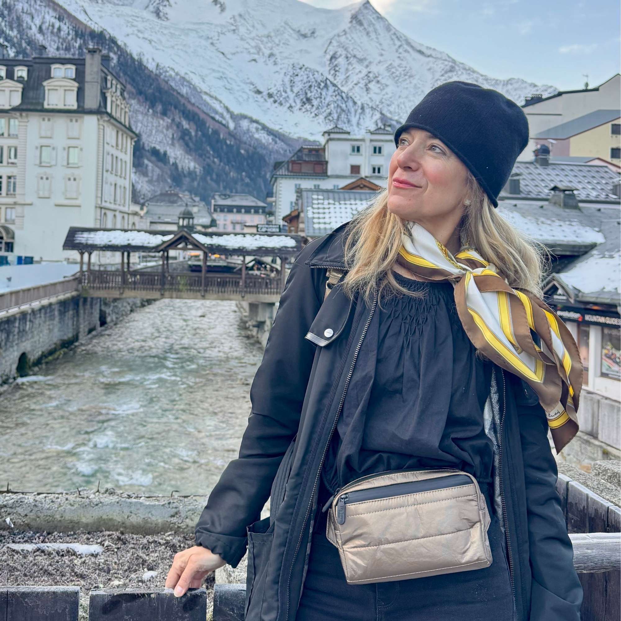 Woman wearing Puffer Crossbody Fanny Pack Belt Bag in Shimmer Bronze