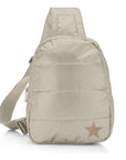 Puffer crossbody backpack in shimmer beige with star on white background