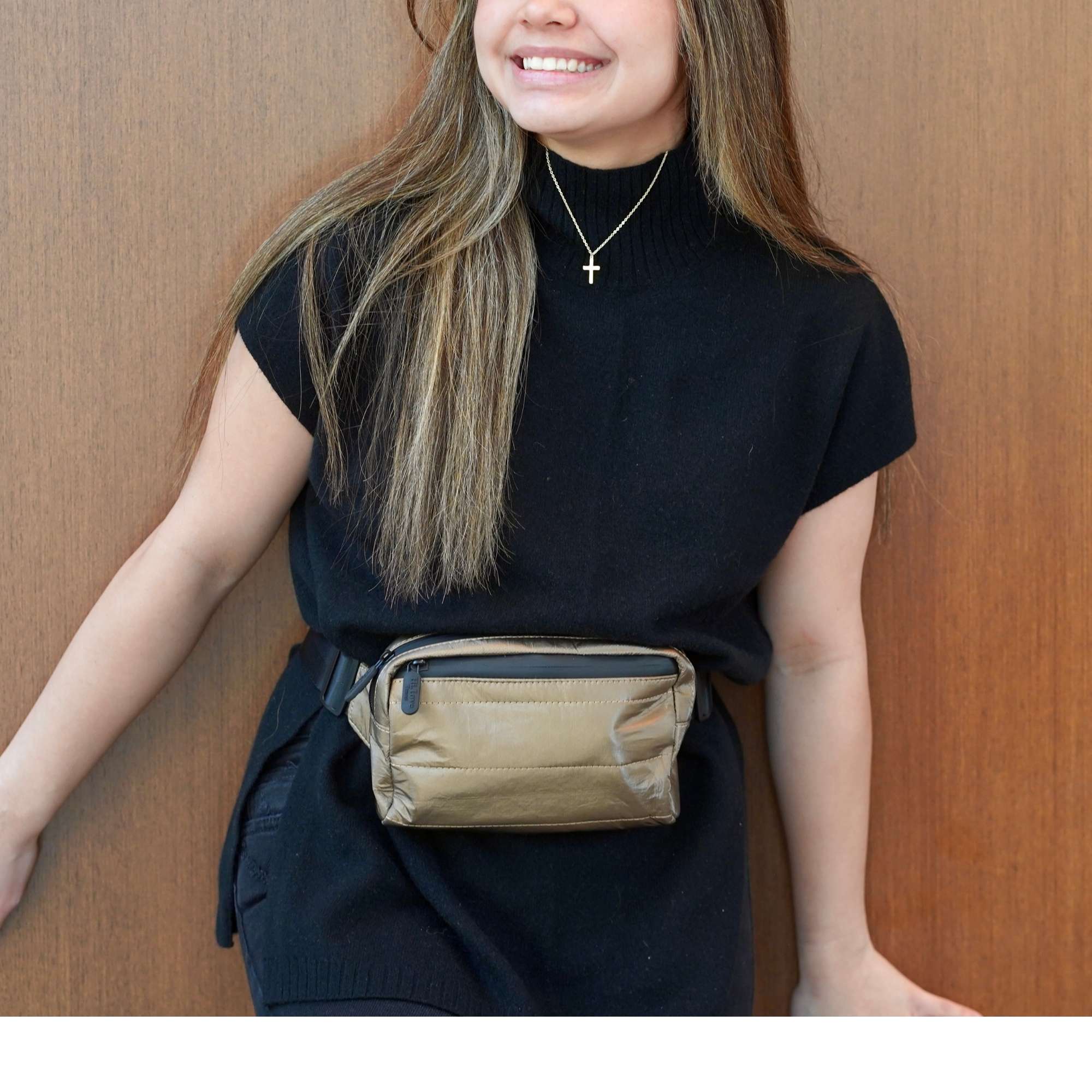 Woman wearing Puffer Fanny Pack Belt Bag in Shimmer Bronze Black Strap